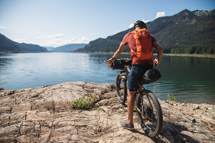 Bikepacker overlooking a lake